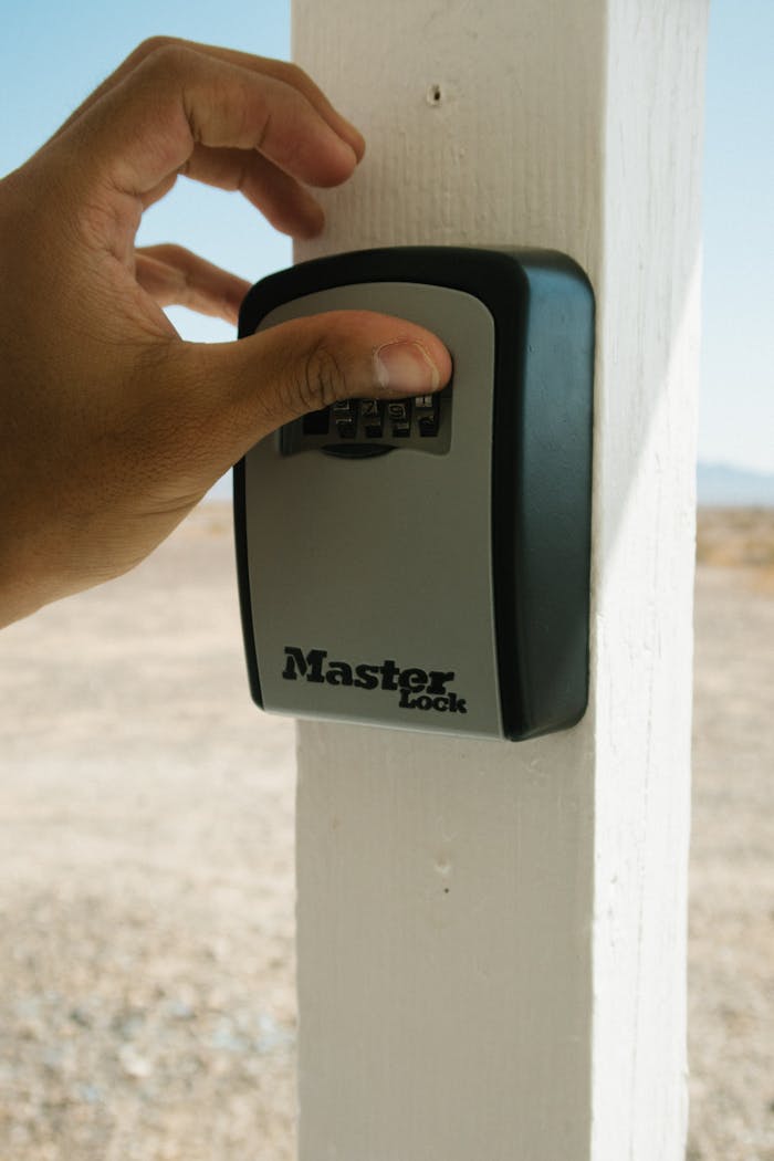 Person Using Master Lock Combination Lock